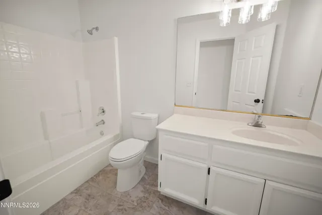 a bathroom with a sink a toilet and a bathtub
