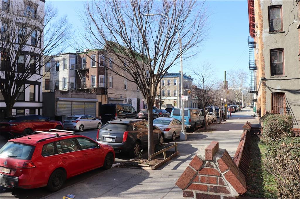1405 Prospect Place, Unit B14 Brooklyn, NY 11213 - Photo 15 of 16 a view of a cars park in front of a building