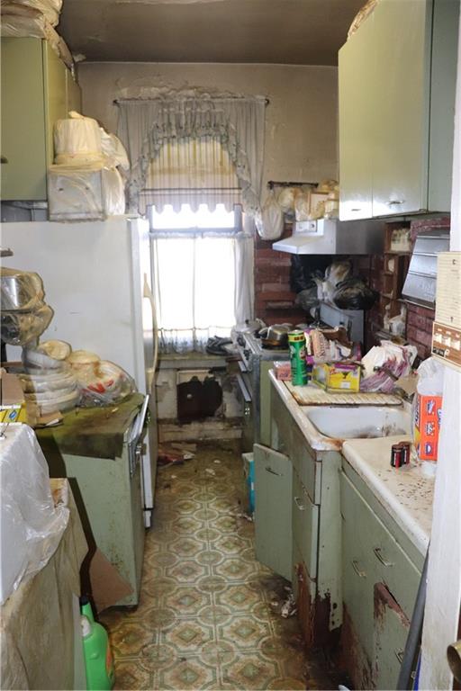 1405 Prospect Place, Unit B14 Brooklyn, NY 11213 - Photo 4 of 16 a kitchen with a sink and a stove top oven