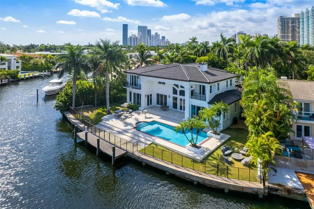 a view of house with swimming pool yard and outdoor seating
