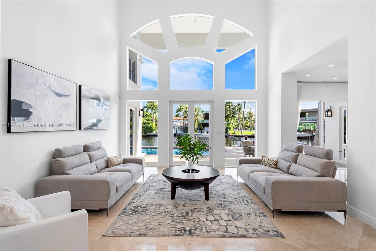 455 Centre Island Golden Beach, FL 33160 - Photo 12 of 67 a living room with furniture a window and a potted plant