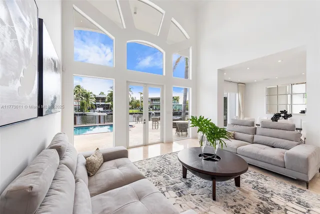 a living room with furniture and a rug