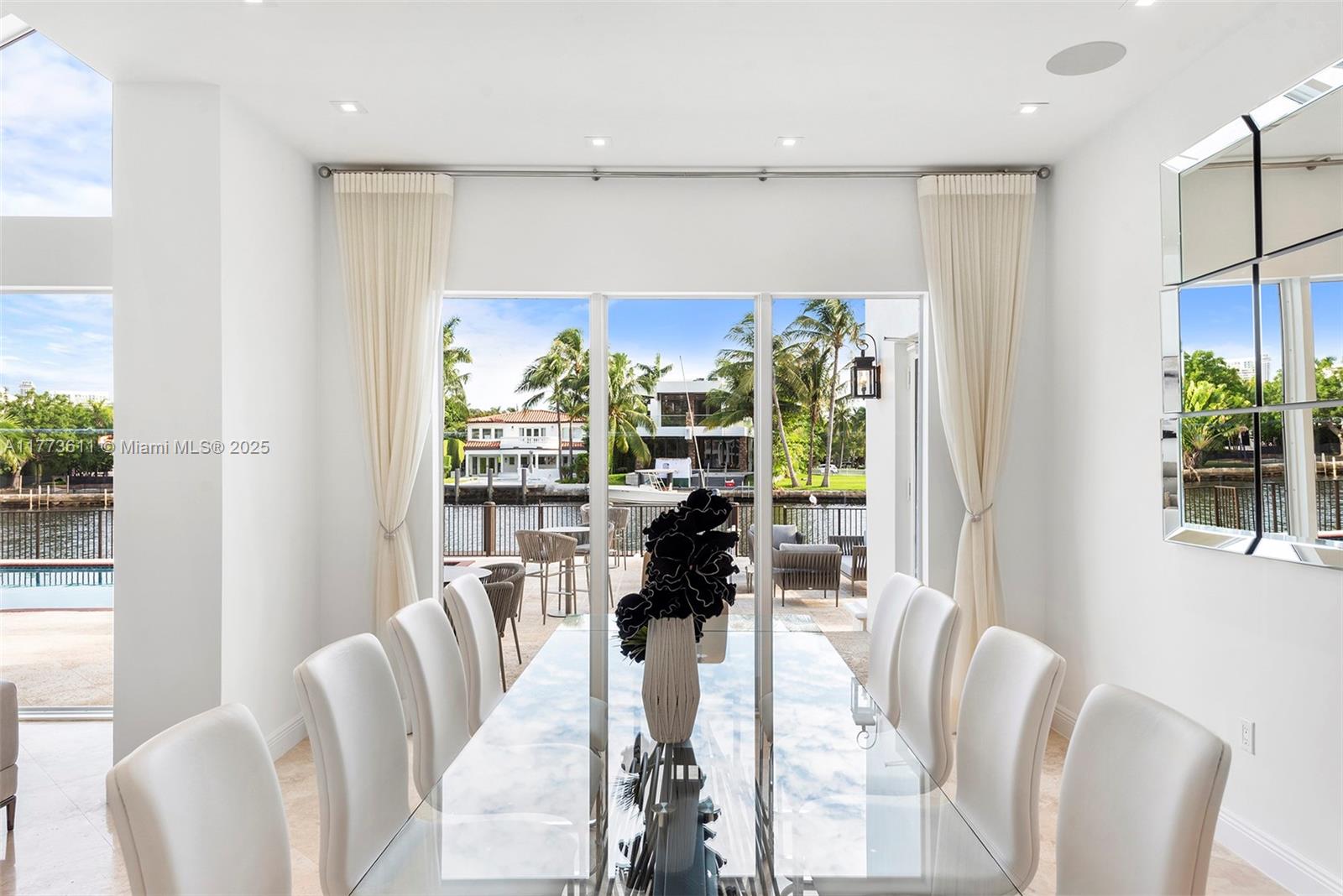 455 Centre Island Golden Beach, FL 33160 - Photo 16 of 67 a view of a dining room with furniture window and outside view