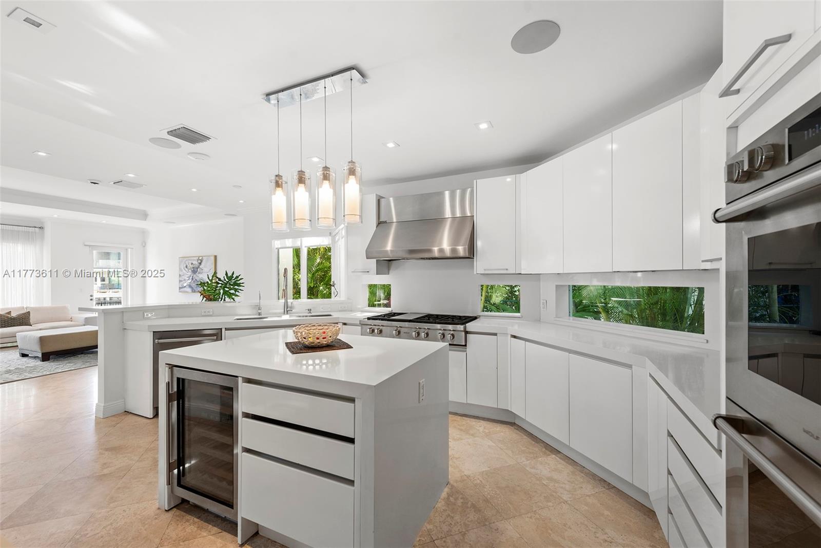 455 Centre Island Golden Beach, FL 33160 - Photo 28 of 67 a kitchen with a stove a sink and a refrigerator