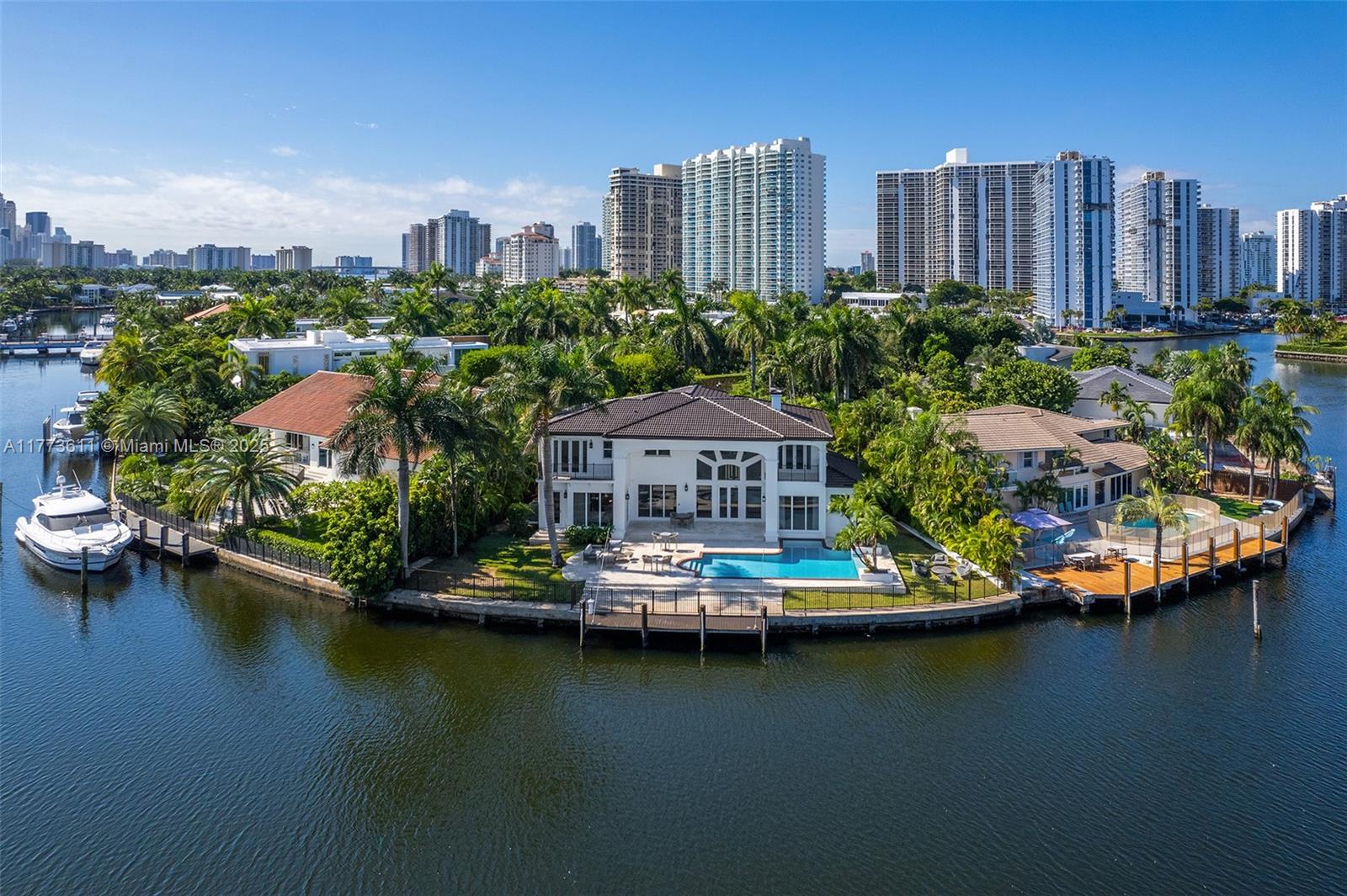 455 Centre Island Golden Beach, FL 33160 - Photo 3 of 67 an aerial view of a city with a lake