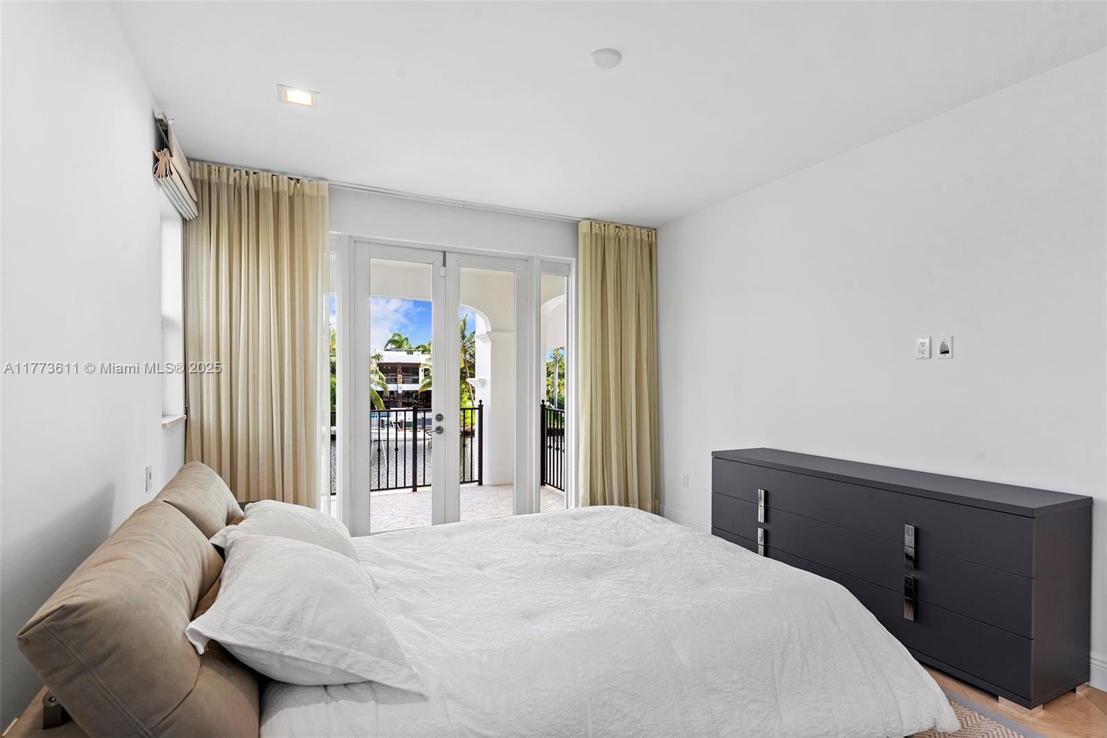 455 Centre Island Golden Beach, FL 33160 - Photo 43 of 67 a bedroom with a bed and a window