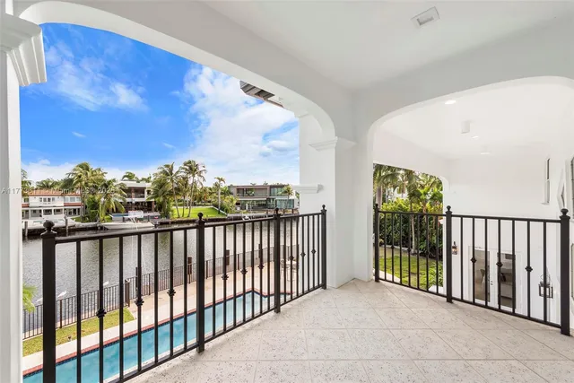 a view of a house with swimming pool and furniture