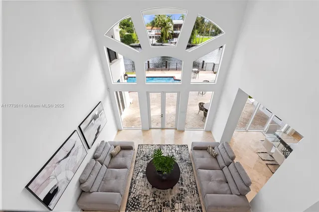 a view of a patio with couches chairs and potted plants