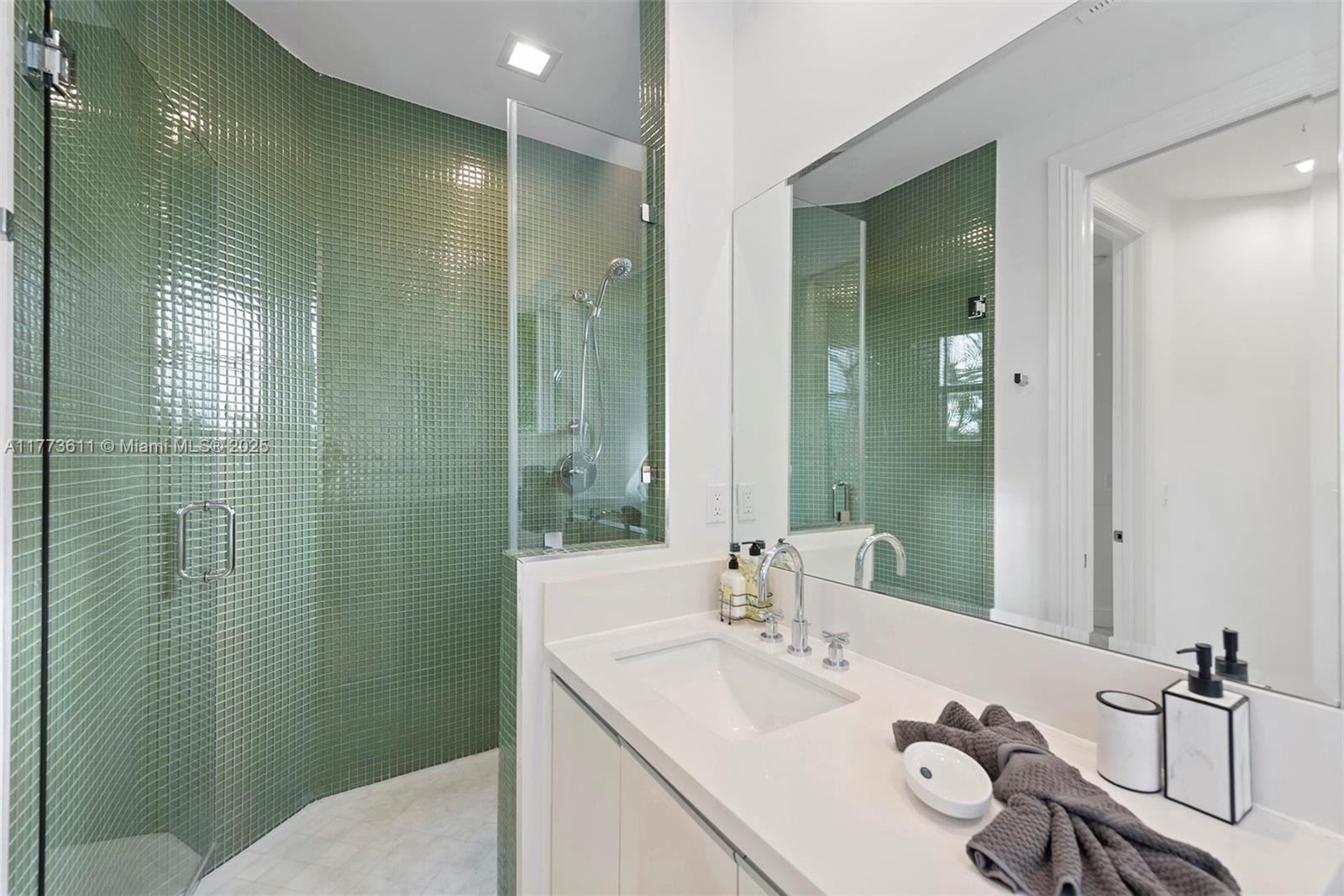 455 Centre Island Golden Beach, FL 33160 - Photo 49 of 67 a bathroom with a sink and a mirror