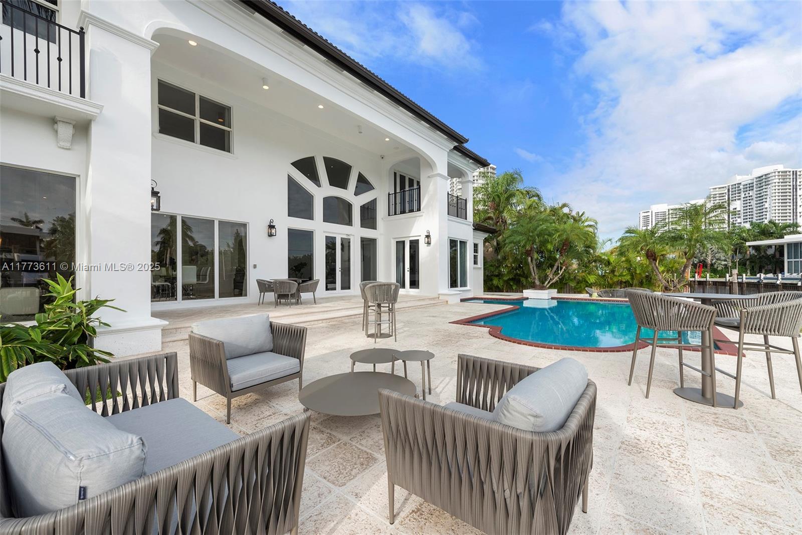 455 Centre Island Golden Beach, FL 33160 - Photo 58 of 67 a view of a house with swimming pool and furniture
