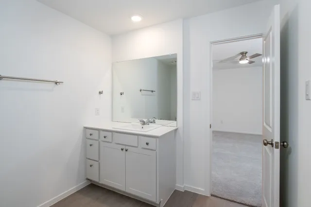 a view of a bathroom with 2 sink and a mirror