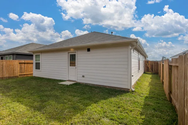 a view of a backyard with pathway