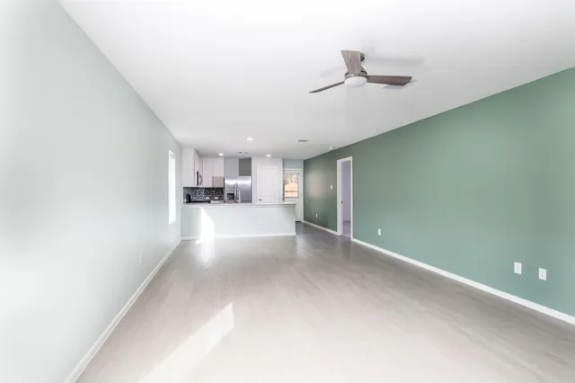a view of a kitchen with a sink and a window