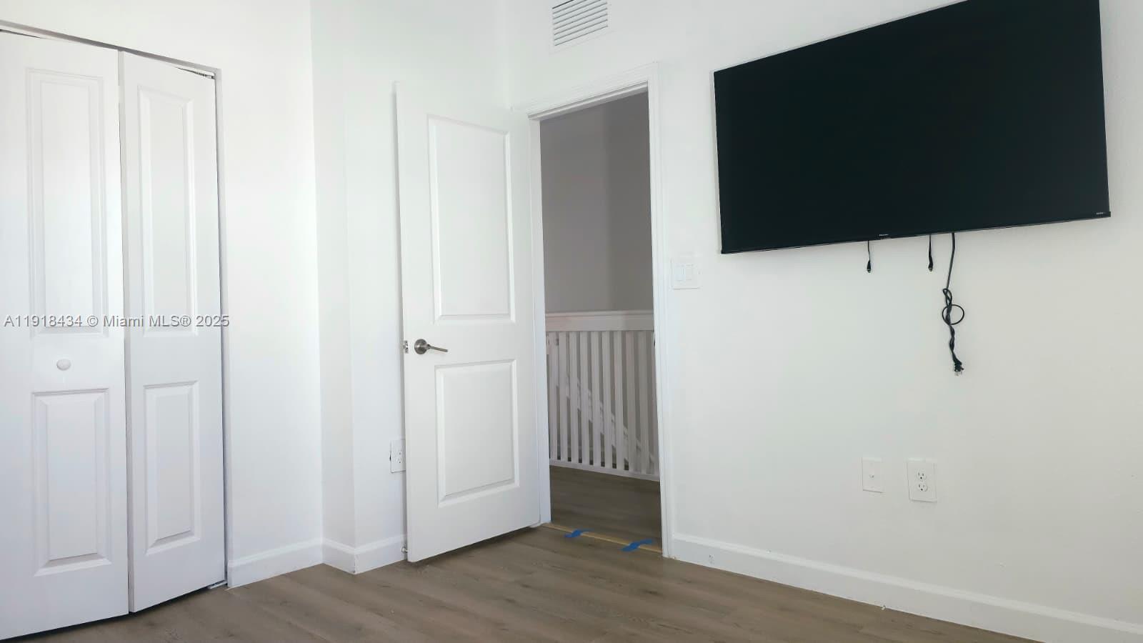 11774 Southwest 246th Street, Unit 11774 Homestead, FL 33032 - Photo 11 of 18 a view of a utility room with wooden floor
