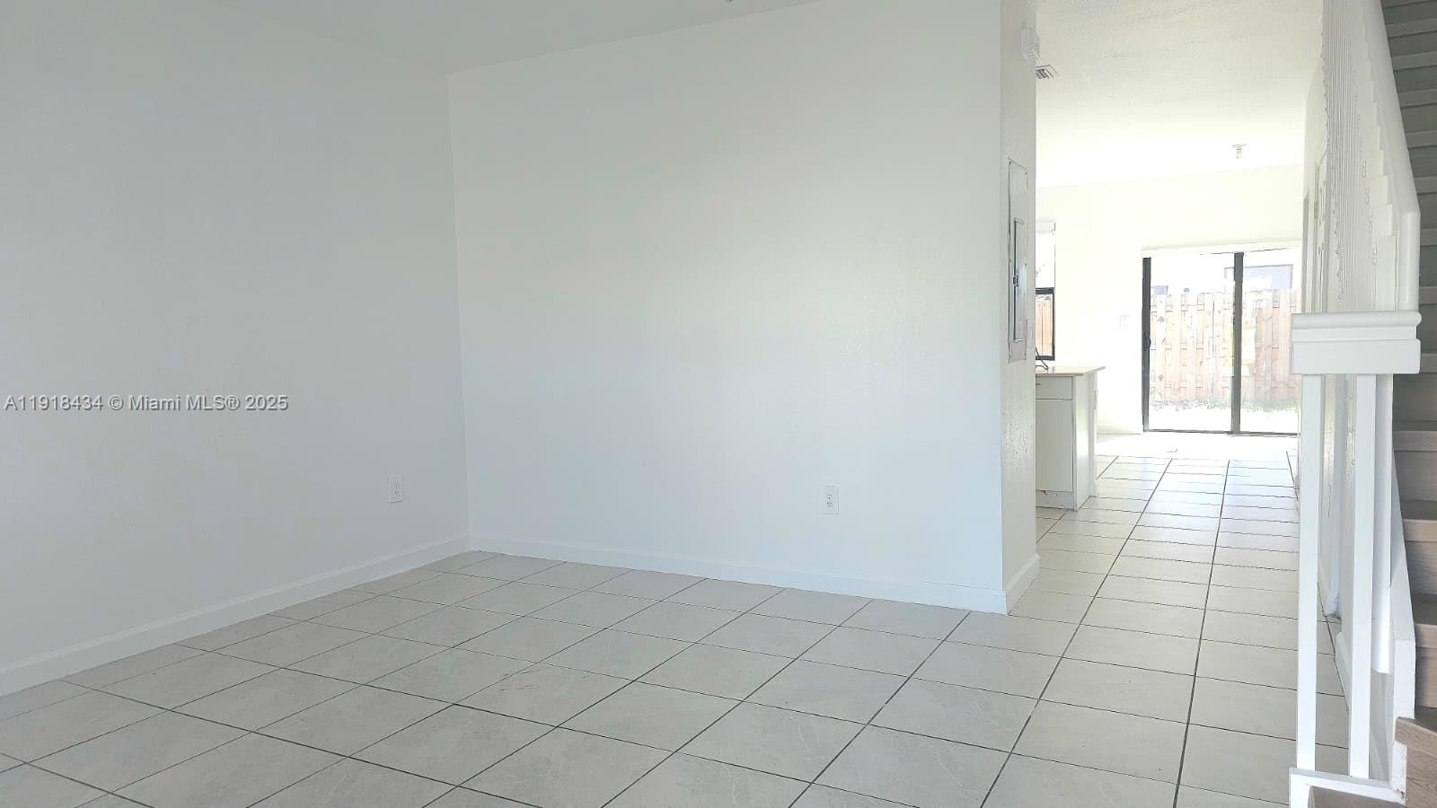 11774 Southwest 246th Street, Unit 11774 Homestead, FL 33032 - Photo 3 of 18 a view of a room with white walls