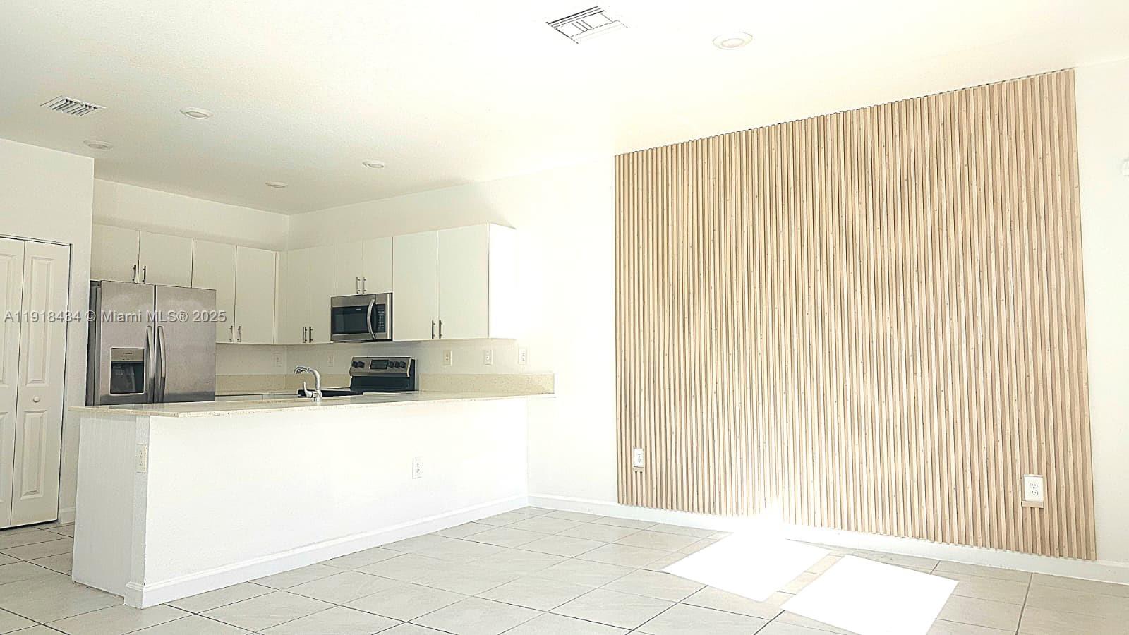 11774 Southwest 246th Street, Unit 11774 Homestead, FL 33032 - Photo 5 of 18 a large bathroom with a tub and sink