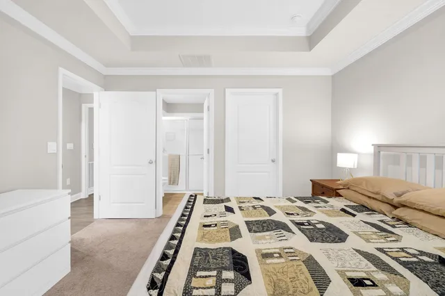 a bedroom with a bed and a couch