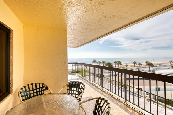a view of balcony with furniture