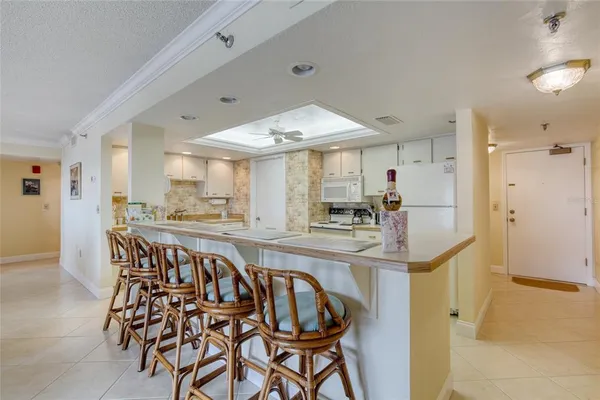 a view of a kitchen and dining room