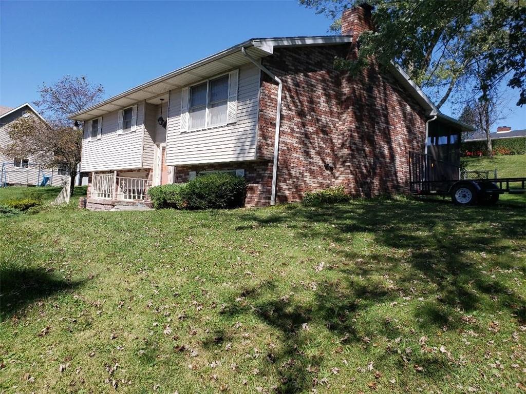 812 6th Street Rochester, PA 15074 - Photo 1 of 8 a front view of a house with a garden