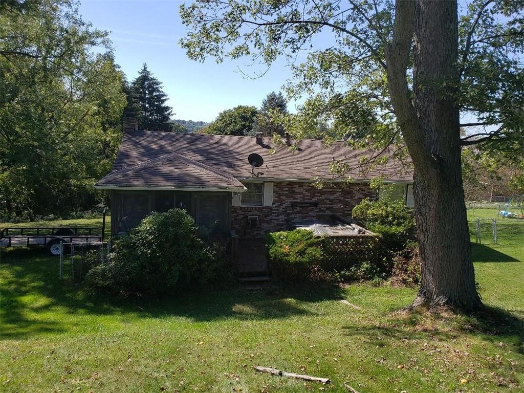 812 6th Street Rochester, PA 15074 - Photo 5 of 8 a view of a garden with a large tree