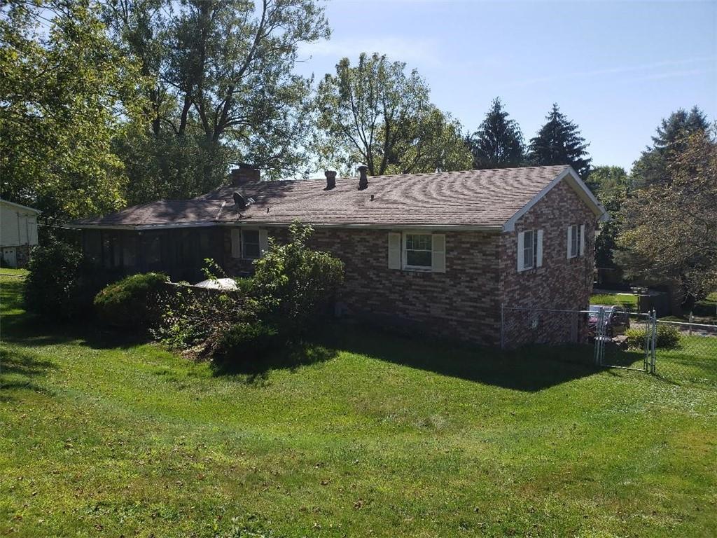812 6th Street Rochester, PA 15074 - Photo 7 of 8 a view of a house with a garden and a yard