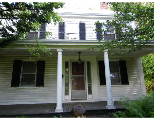 385 Trapelo Road Waltham, MA 02452 - Photo 1 of 4 a front view of a house with a garden