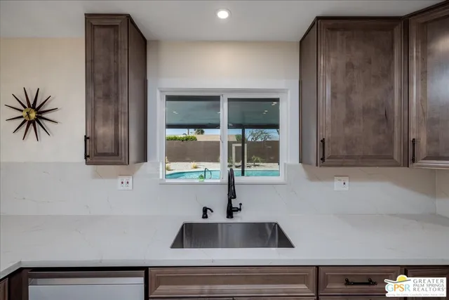 a kitchen with a sink and a window