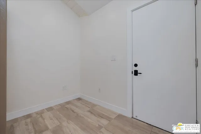 a view of small space with wooden floor