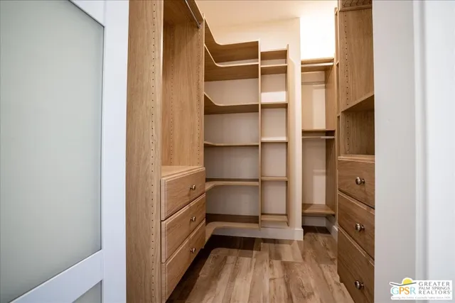view of a bathroom with a sink and mirror
