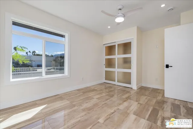 a bathroom with a double vanity sink toilet mirror and shower