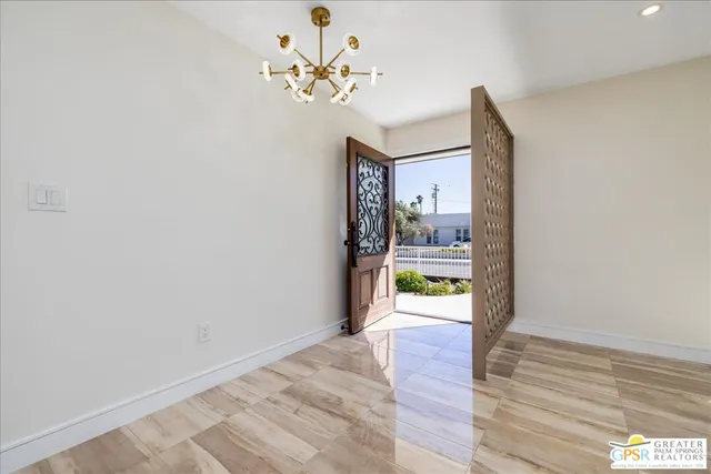 a view of an entryway with wooden floor