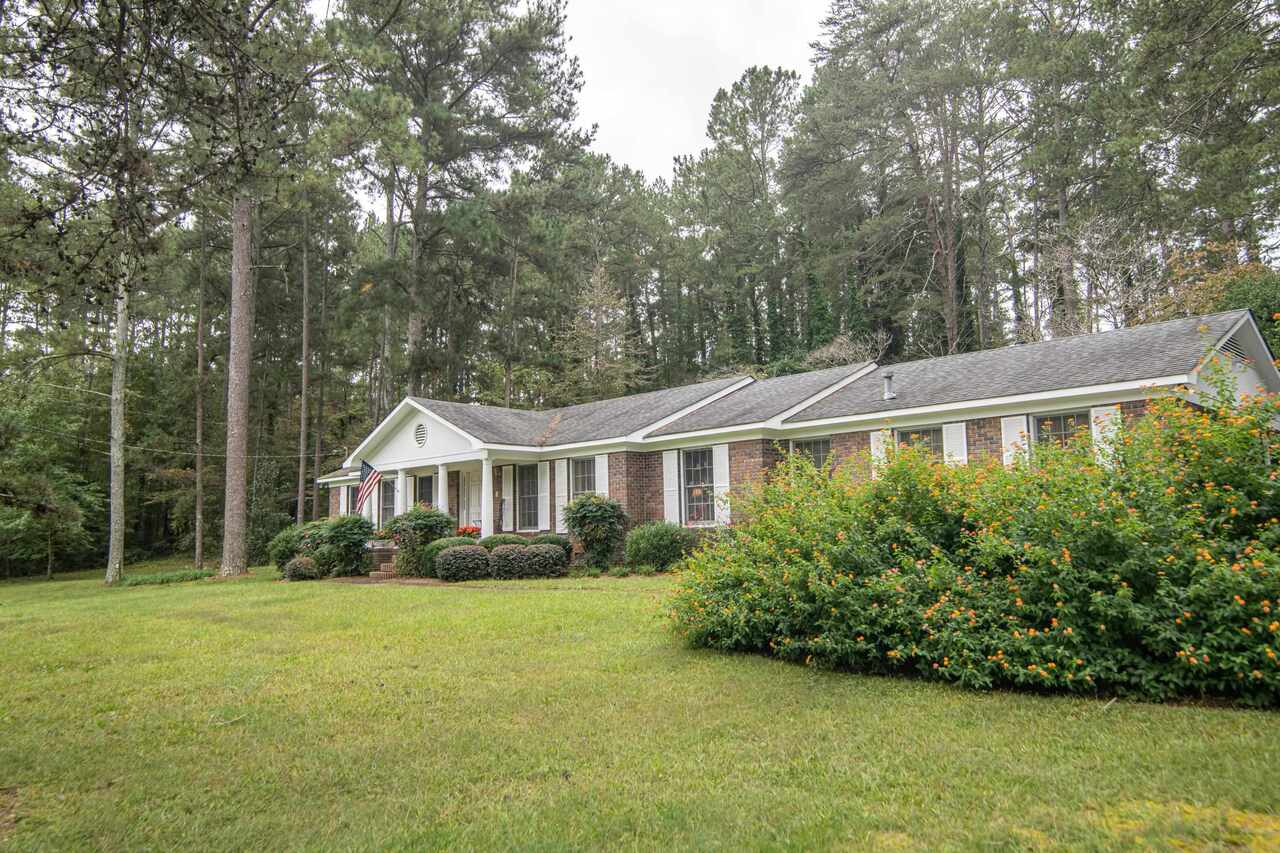 286 Old Freeman Ferry Road Southeast Rome, GA 30161 - Photo 1 of 1 a front view of a house with a yard and trees