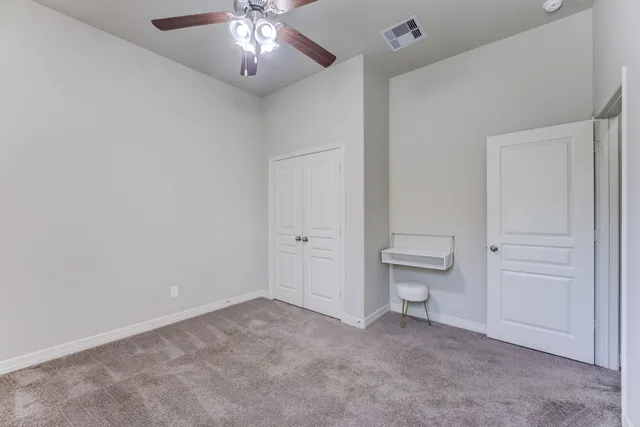 a view of a livingroom and a bathroom