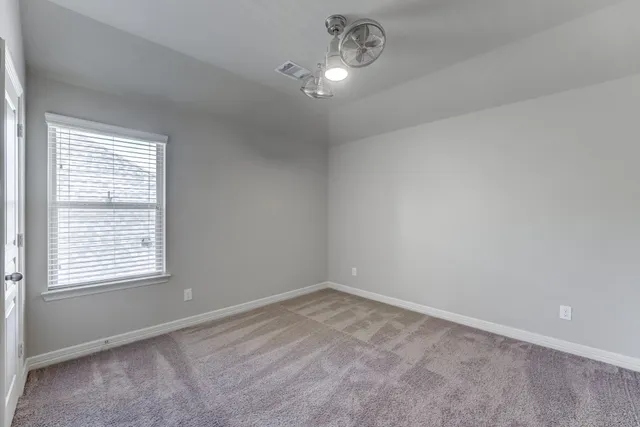 an empty room with a empty space and a window