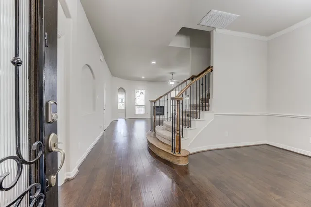 a view of entryway with wooden floor