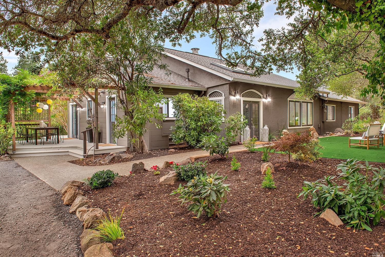 13801 Occidental Road Sebastopol, CA 95472 - Photo 1 of 1 a front view of a house with garden