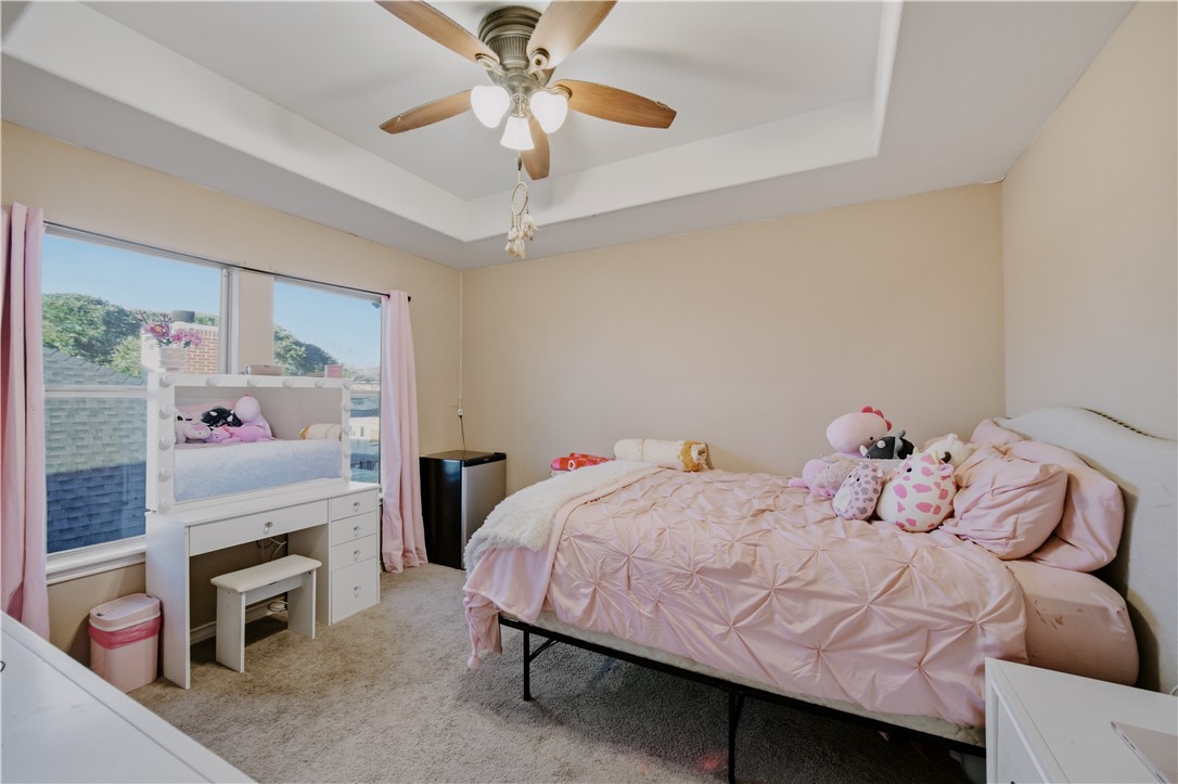 337 Wright Drive Portland, TX 78374 - Photo 20 of 30 a bedroom with a bed and a fireplace