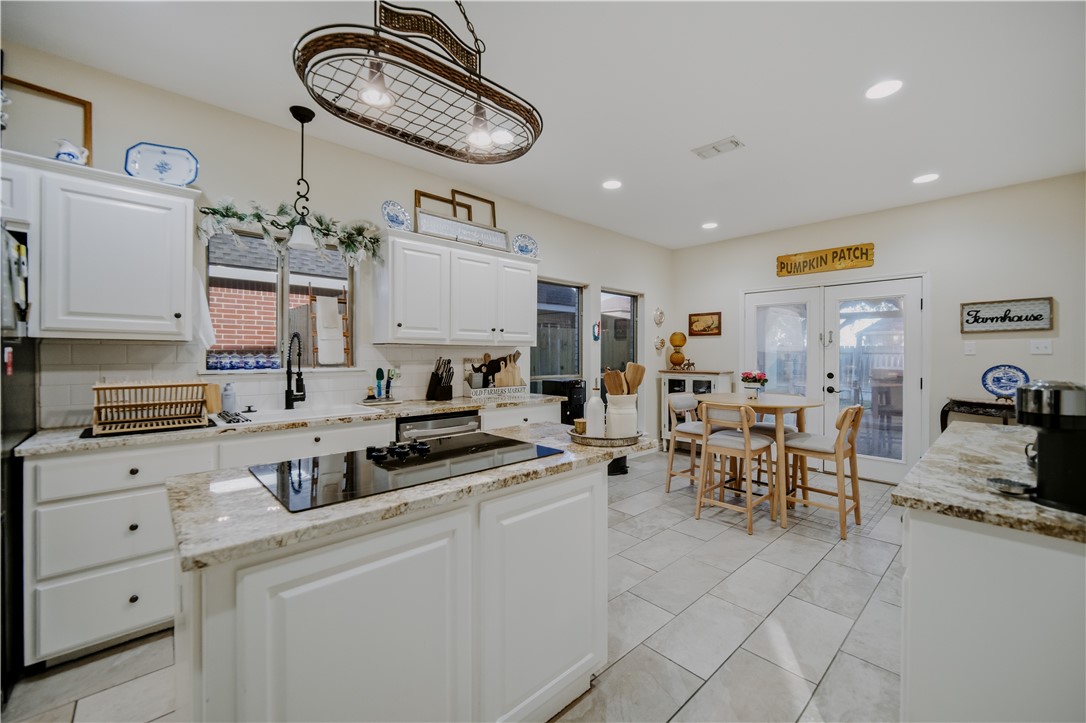 337 Wright Drive Portland, TX 78374 - Photo 6 of 30 a kitchen with cabinets and chairs