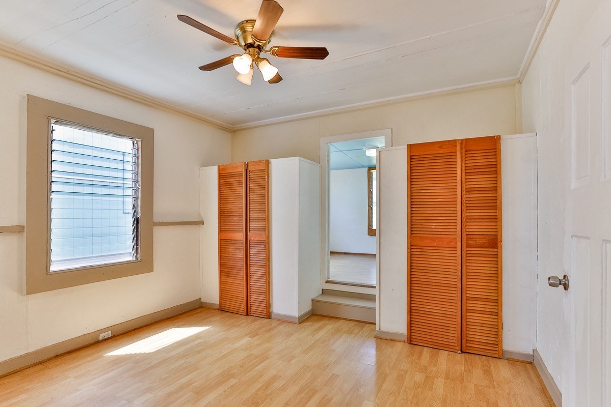 43-350 Pohakea Road, Unit 9 Paauilo, HI 96776 - Photo 13 of 28 wooden floor in an empty room with a window