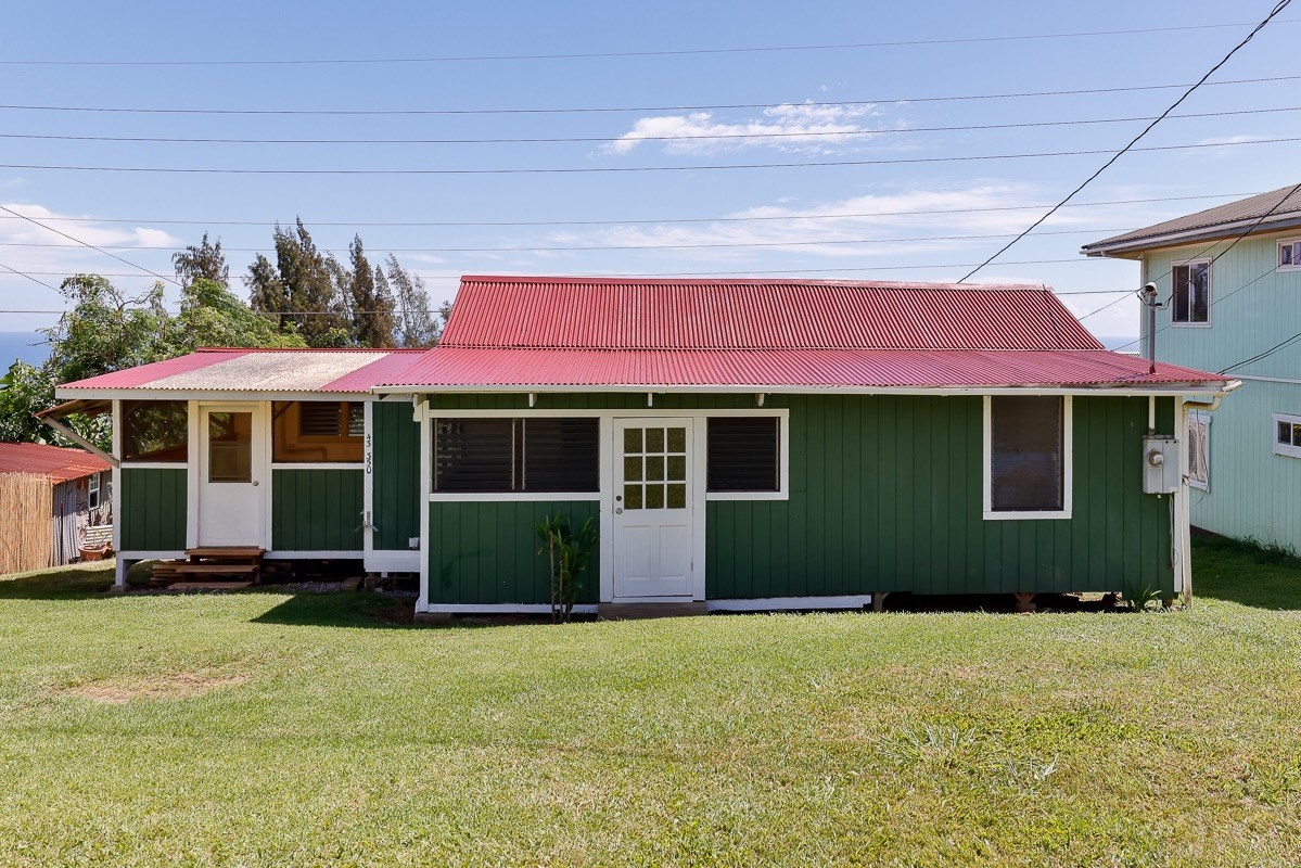 43-350 Pohakea Road, Unit 9 Paauilo, HI 96776 - Photo 2 of 28 a front view of a house with a yard
