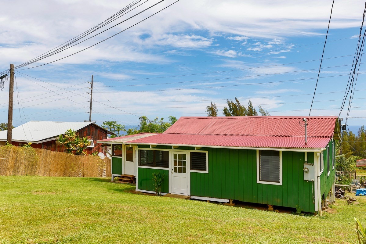 43-350 Pohakea Road, Unit 9 Paauilo, HI 96776 - Photo 24 of 28 a front view of a house with a yard