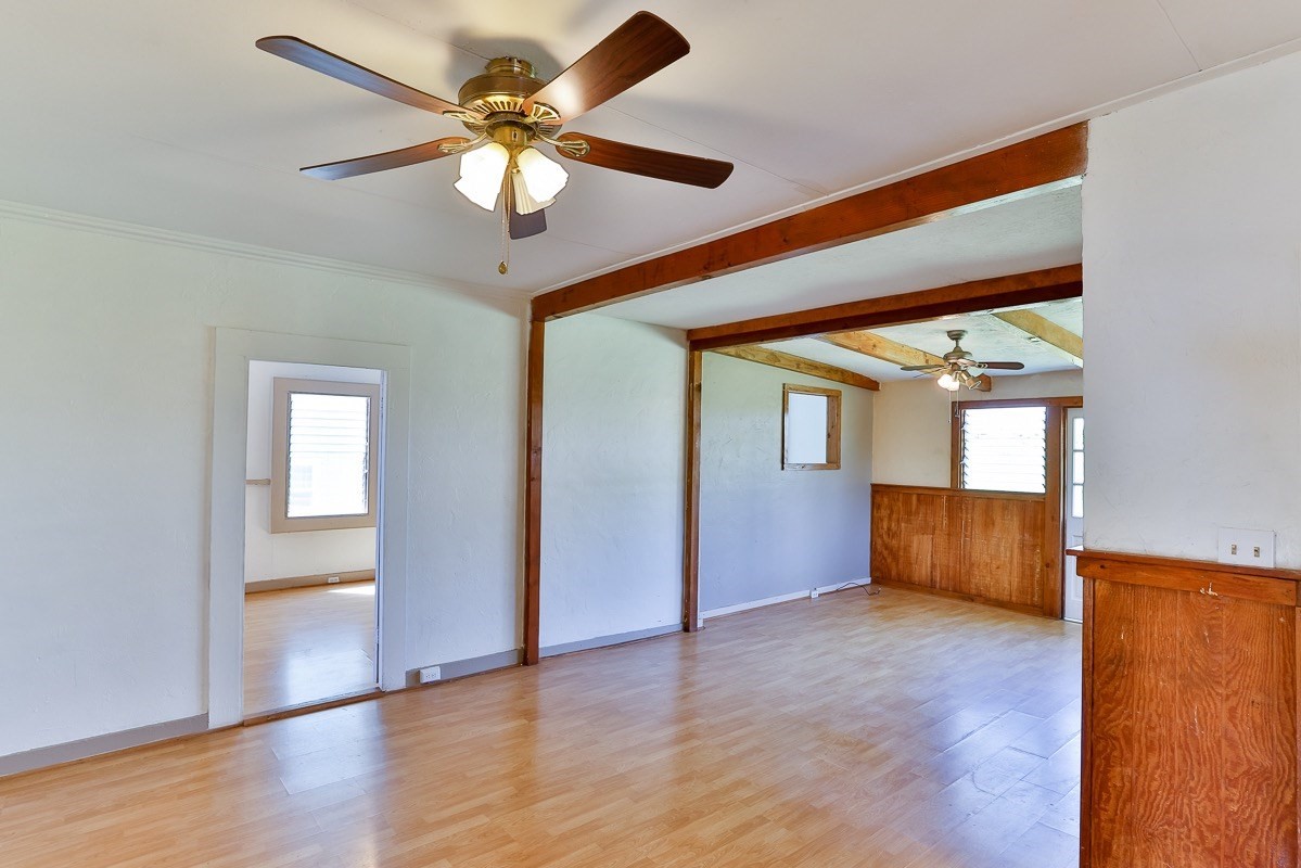 43-350 Pohakea Road, Unit 9 Paauilo, HI 96776 - Photo 4 of 28 a view of an empty room with window and wooden floor