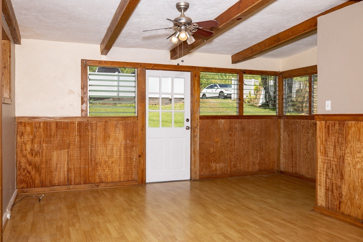 43-350 Pohakea Road, Unit 9 Paauilo, HI 96776 - Photo 8 of 28 an empty room with wooden floor and windows