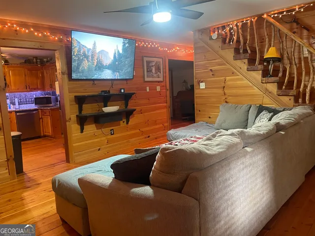 a living room with furniture and a flat screen tv