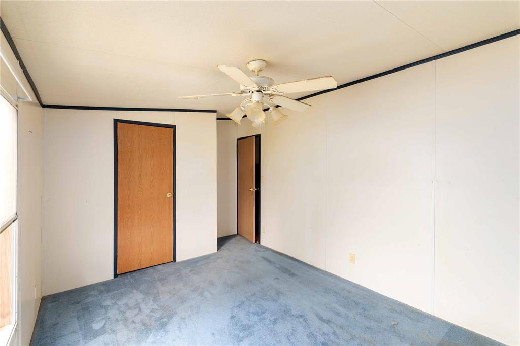 210 7th Street Blanket, TX 76432 - Photo 13 of 33 a view of an empty room with a ceiling fan