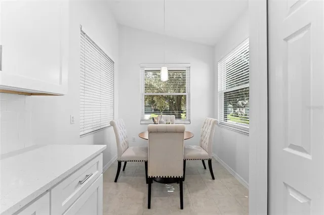 a view of a bedroom with wooden floor and tub