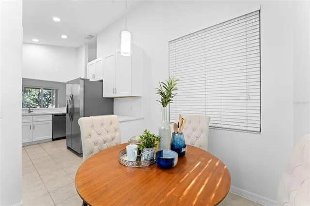 a spacious bathroom with a double vanity sink a mirror and a bathtub
