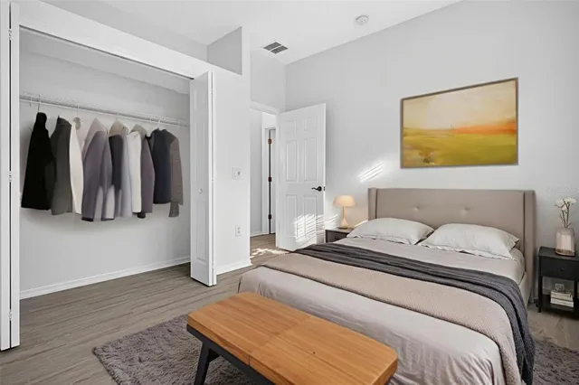 an aerial view of a house with a yard and trees