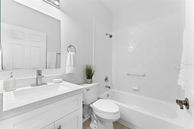 a view of a swimming pool with a table and chairs